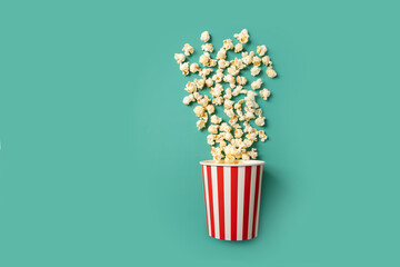 Popcorn bucket, movie theater entertainment, film snack classic box,green background, copy space