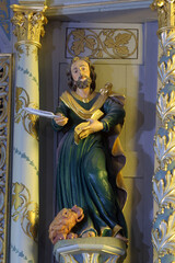 Obraz premium Saint Mark the Evangelist, statue on High altar in the Parish Church of Exaltation of the Holy Cross in Kriz, Croatia