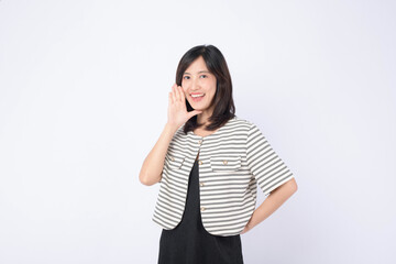Asian woman is posing with a shouting gesture against a white background.