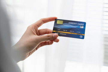 Woman holding credit cards to pay and spend payment for goods.