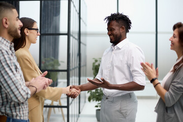 Confident business partners meet in an office building and talk