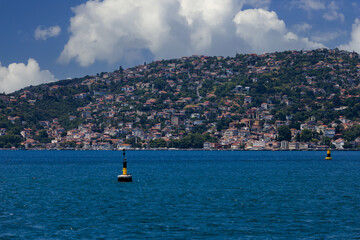 Turquoise blue sea water. View of the Bosphorus in Istanbul city on sunny summer day, in a public...