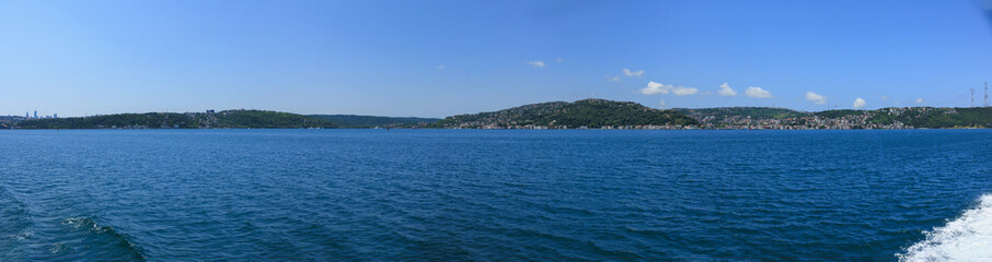 Turquoise blue sea water. View of the Bosphorus in Istanbul city on sunny summer day, in a public place.