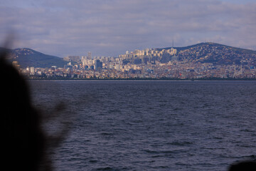 Turquoise blue sea water. View of the Bosphorus in Istanbul city on sunny summer day, in a public place.