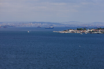 Fototapeta premium Turquoise blue sea water. View of the Bosphorus in Istanbul city on sunny summer day, in a public place.