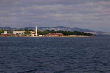 Turquoise blue sea water. View of the Bosphorus in Istanbul city on sunny summer day, in a public place.