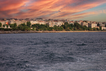 Orange sky at sunset in the evening. Seascape overlooking the coast in the city of Istanbul