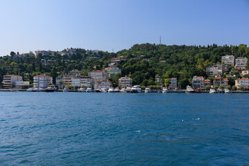 Fototapeta premium Turquoise blue sea water. View of the Bosphorus in Istanbul city on sunny summer day, in a public place.