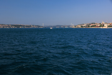 Turquoise blue sea water. View of the Bosphorus in Istanbul city on sunny summer day, in a public place.