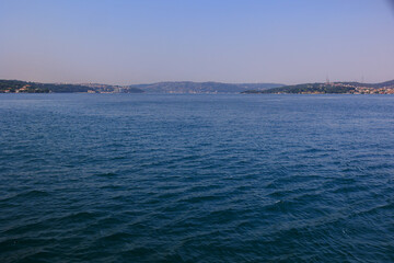 Turquoise blue sea water. View of the Bosphorus in Istanbul city on sunny summer day, in a public place.