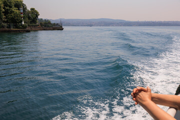 Turquoise blue sea water. View of the Bosphorus in Istanbul city on sunny summer day, in a public...