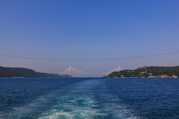 Turquoise blue sea water. View of the Bosphorus in Istanbul city on sunny summer day, in a public place.