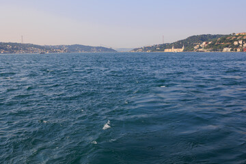 Turquoise blue sea water. View of the Bosphorus in Istanbul city on sunny summer day, in a public place.