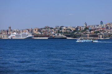 Obraz premium Blue seascape overlooking the coast. View of the Bosphorus in Istanbul city on sunny summer day, in a public place.