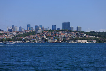Fototapeta premium Blue seascape overlooking the coast. View of the Bosphorus in Istanbul city on sunny summer day, in a public place.