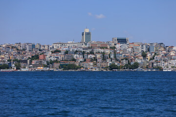 Fototapeta premium Blue seascape overlooking the coast. View of the Bosphorus in Istanbul city on sunny summer day, in a public place.