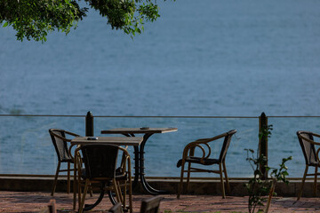 Beautiful views from above, tables in a cafe in the mountains and a panoramic view of the city, public places in Turkey, on a sunny summer day