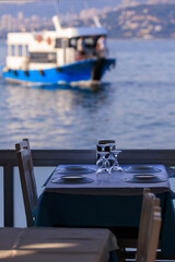 Beautiful views from above, tables in a cafe in the mountains and a panoramic view of the city, public places in Turkey, on a sunny summer day