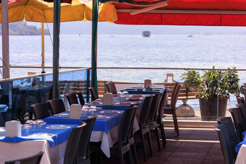 Beautiful views from above, tables in a cafe in the mountains and a panoramic view of the city, public places in Turkey, on a sunny summer day