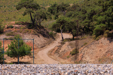 Beautiful road and landscape, streets and roads of a southern small town, public place in Turkey, on a summer sunny day