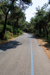 Beautiful road and landscape, streets and roads of a southern small town, public place in Turkey, on a summer sunny day
