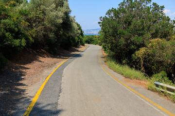 Beautiful road and landscape, streets and roads of a southern small town, public place in Turkey, on a summer sunny day