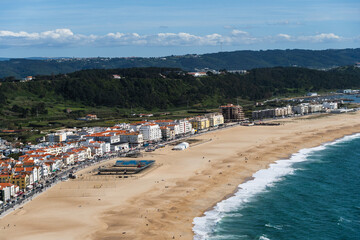 View from the hill to the sandy beach 'Praia da Nazaré' , Praia do Norte beach and Nazare town, Portugal