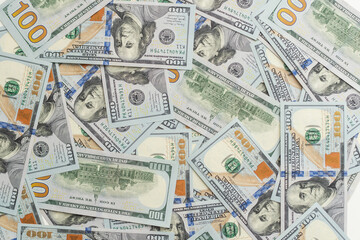Banknotes of 100 American dollars top view, close-up.