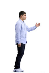 A man, full-length, on a white background, calls to him