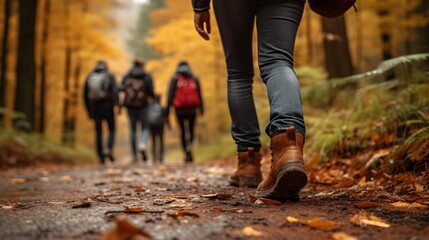 Obraz premium Close up of people walking in autumn forest, blurred background. Generative AI.