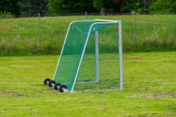 Close-up of football field with mobile goal with wheels at Swiss City of Zürich on a cloudy spring afternoon. Photo taken May 26th, 2024, Zurich, Switzerland.