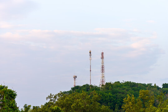 Telecommunication tower in boondocks remote area with forest and mountain background for telecommunication infrastructure concept.