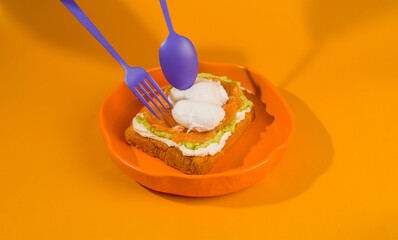 A plate of food with a fork and spoon on it