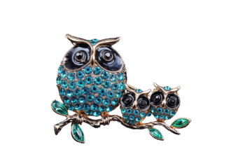 This brooch features an adorable owl family adorned with sparkling crystals