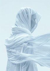 A person is wearing a white scarf and is standing in front of a white background