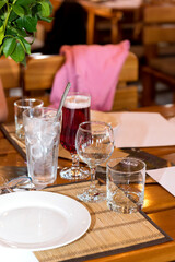 Glasses for wine and drinks on the table. Festive drinks in the cafe.