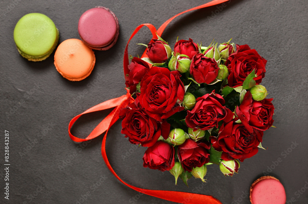 Wall mural bouquet of red roses and macaroon cookies for a gift