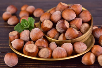 Hazelnuts on a dark wooden background.Close-up.
