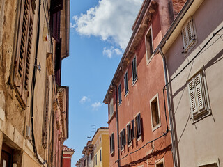Stone houses with bright colors in a street of Pula. Istria, Croatia, Europe