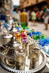 Fototapeta premium Shopping in Souk Semmarine - Bustling market offering everything from colorful clothing & fabrics to antiques, food & spices.