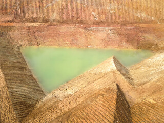 A pond dug for agricultural. Water reservoir for irrigation in agriculture.