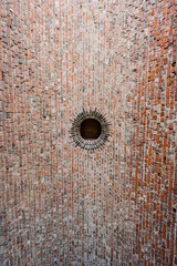 Hole in a curved inner stone roof of a medieval building.