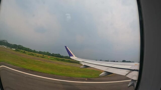View outside the plane window when taking off from Halim Perdana Kusuma airport