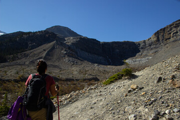 Woman hiker walking through the Rocky Mountains of Canada.