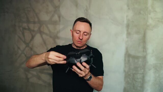 Indoors Setup: FPV Drone Pilot Adjusting Goggles