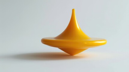 Fototapeta premium Yellow spinning top against white backdrop
