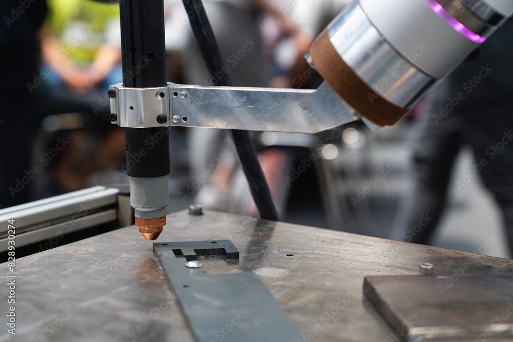 Poster Automatic welding robot in a modern factory in operation.