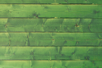 Green painted wood texture, wooden background.