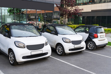 White rental cars in a row