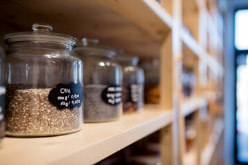 Food containers in zero waste shop filled with raw food.